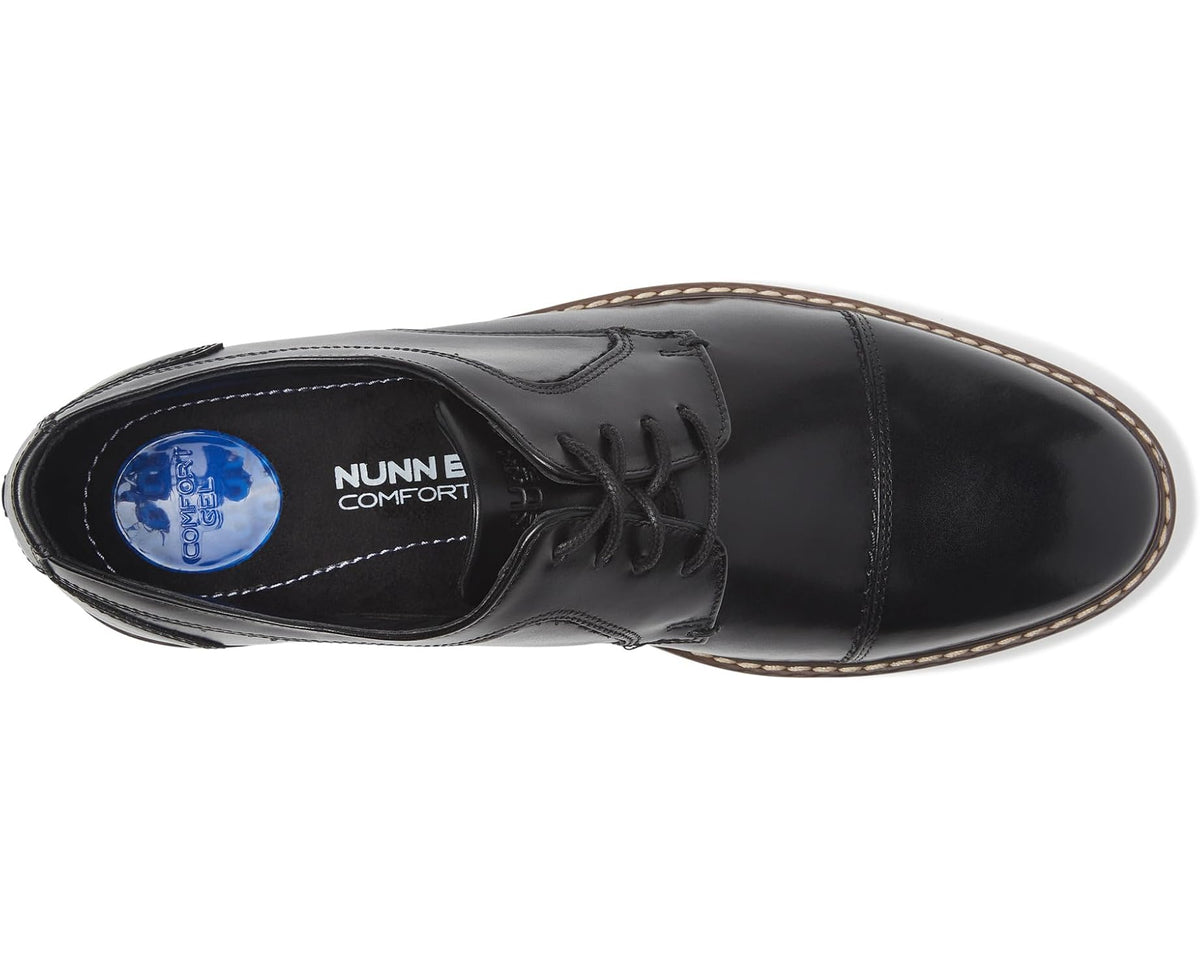 Black cap-toe Oxford shoe showing blue NUNN Comfort insole label