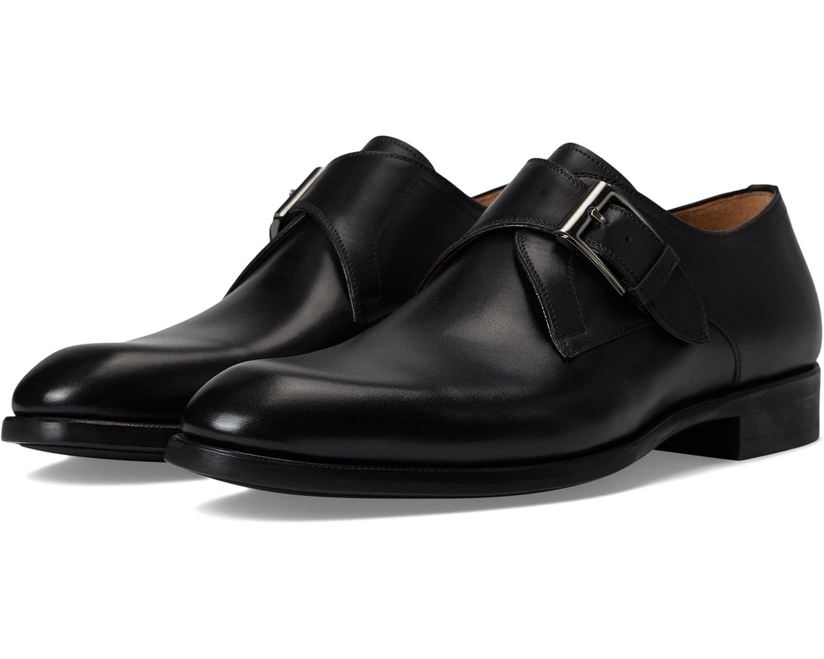 Black leather men's dress shoes with double-strap buckle, side view.