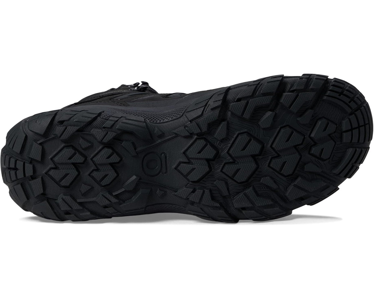 Black boot outsole with aggressive lug tread pattern