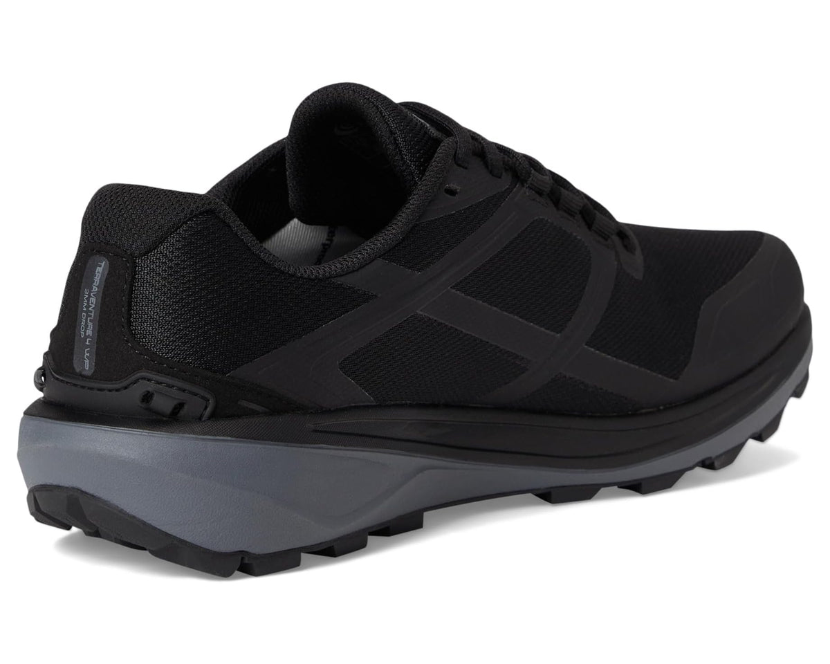 Black low-profile trail sneaker with padded collar and lace-up mesh upper
