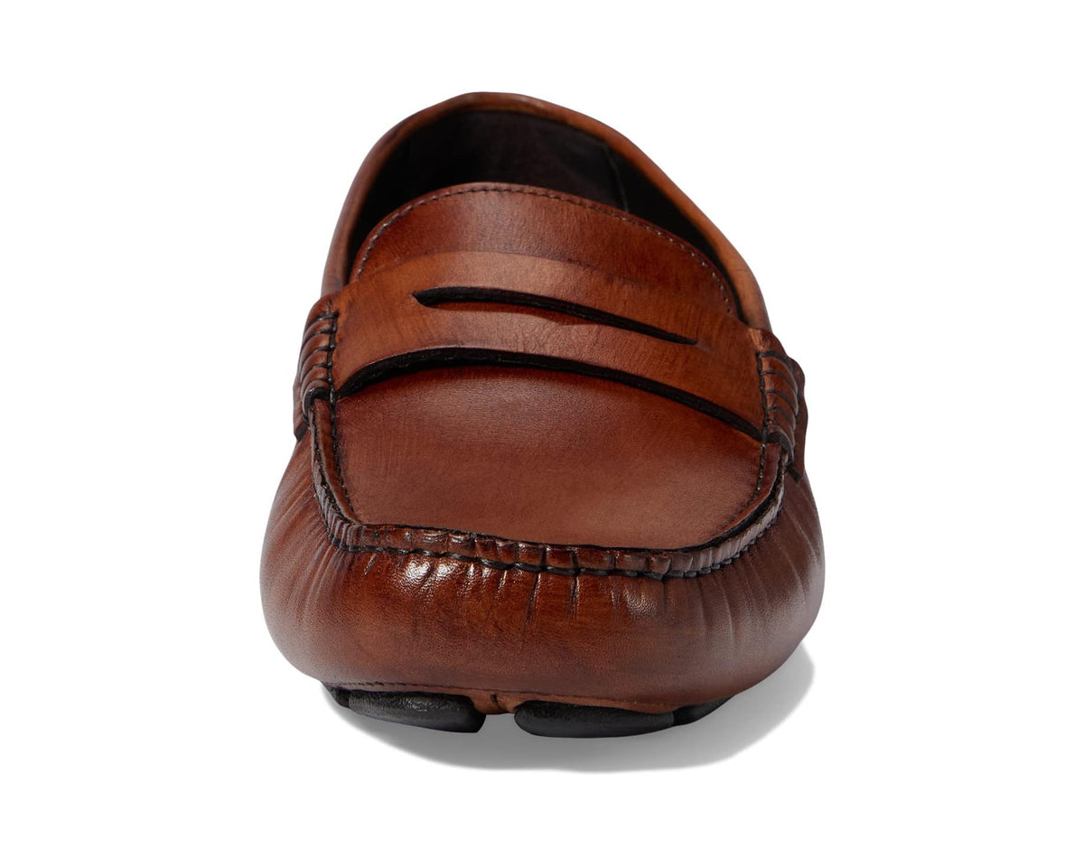Brown leather penny loafer, rear view with strap detail and low-profile sole
