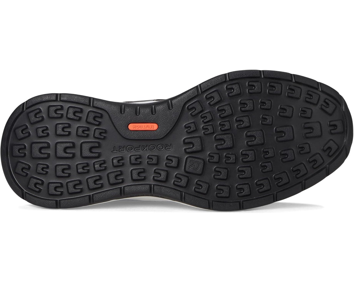 Black rubber outsole with multidirectional traction tread and arch support text