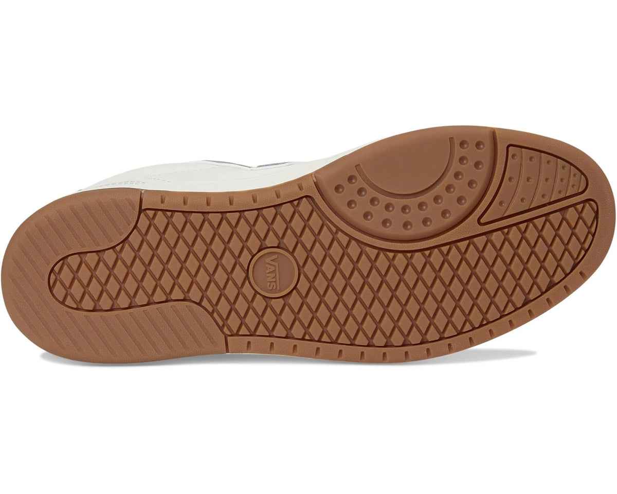 Vans unisex low-top sneaker outsole with brown tread and circular logo detail.