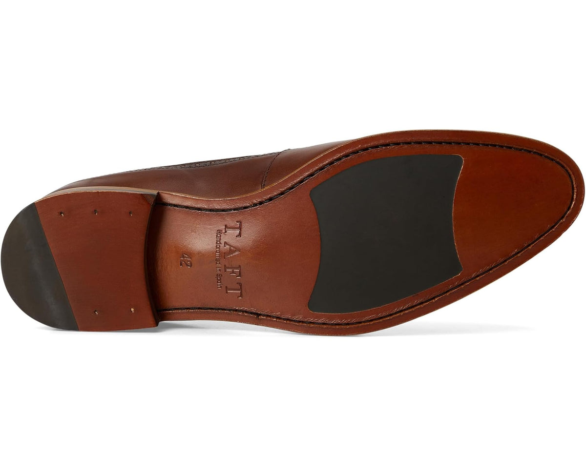 Brown oxford shoe sole with stitched side edge and dark heel inset