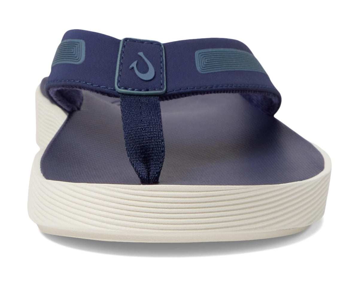 Men's OluKai Leeward navy flip-flops, close-up of toe strap and heel cup