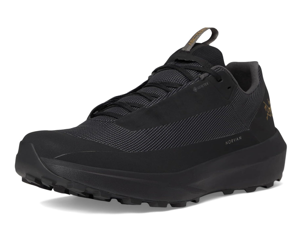 Black lace-up trail running shoe with textured upper and rugged traction outsole