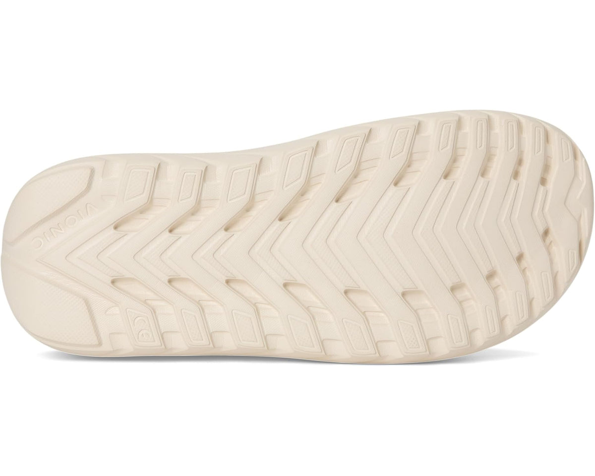 Cream slide sandal with textured treaded outsole