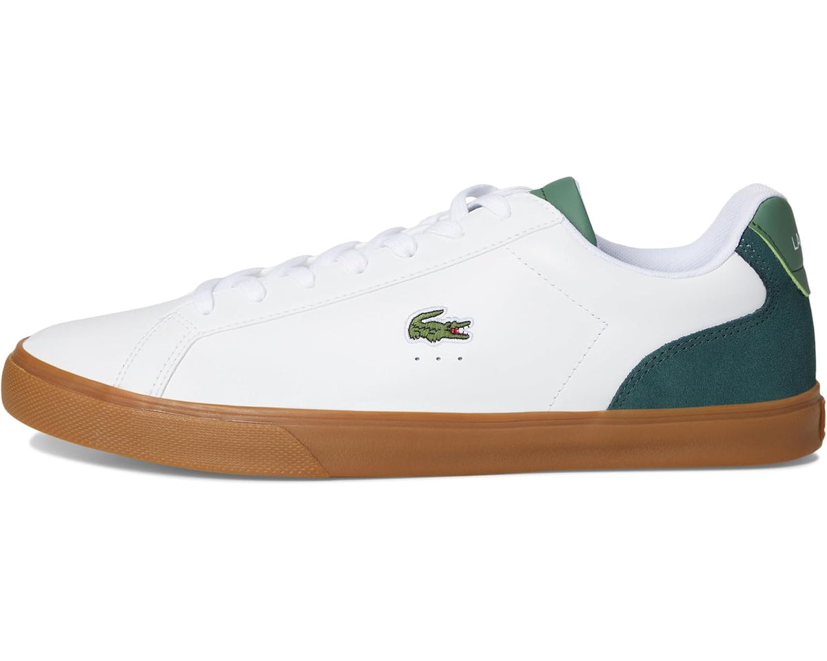 White and green low-top sneakers with crocodile logo and gum rubber sole