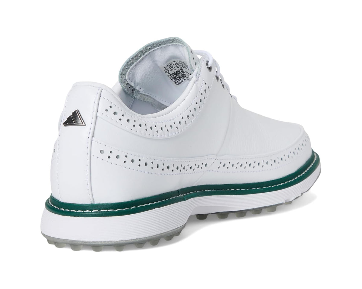 White spikeless golf shoe heel with green stripe, perforated details, and lace eyelets