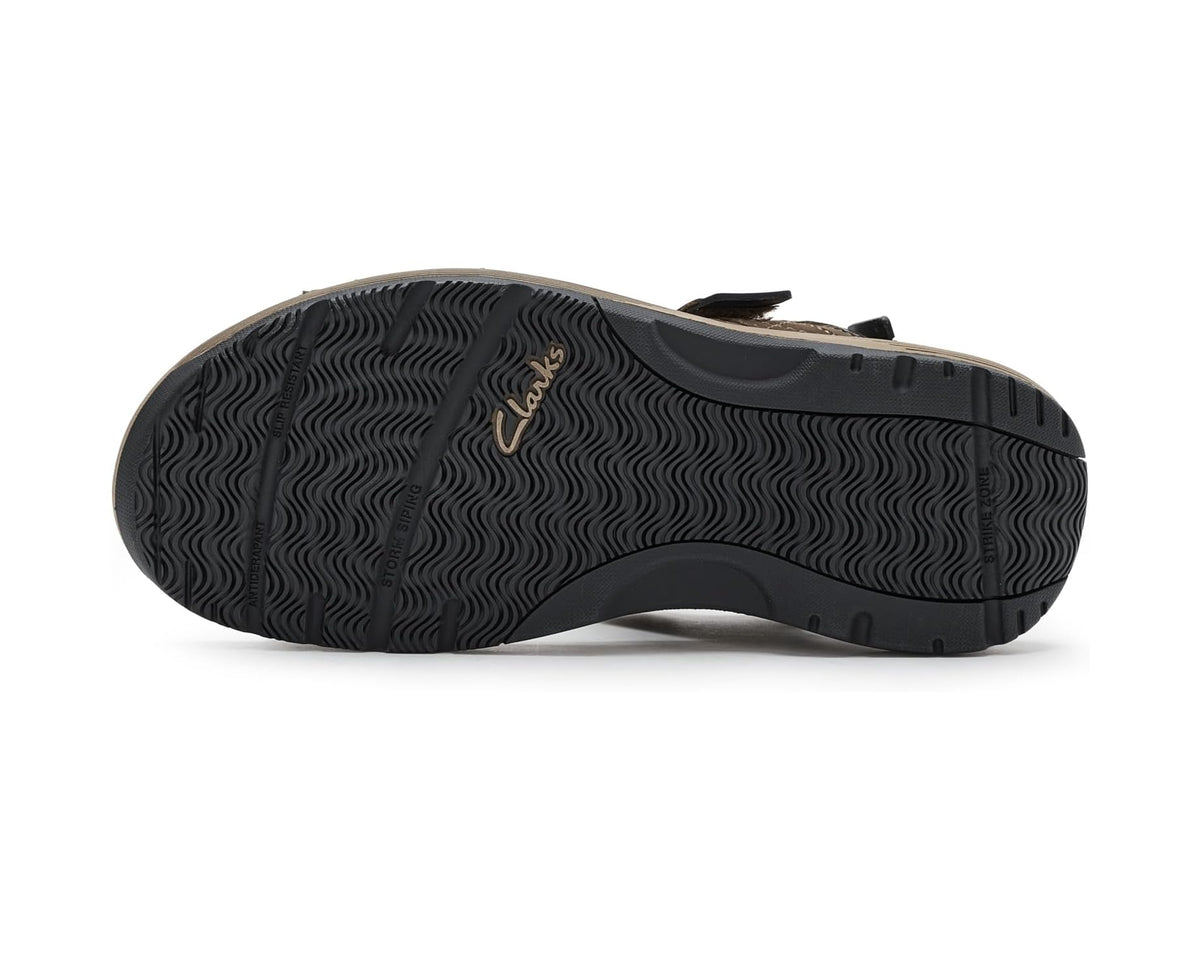 Brown trekking sandal outsole with textured tread pattern