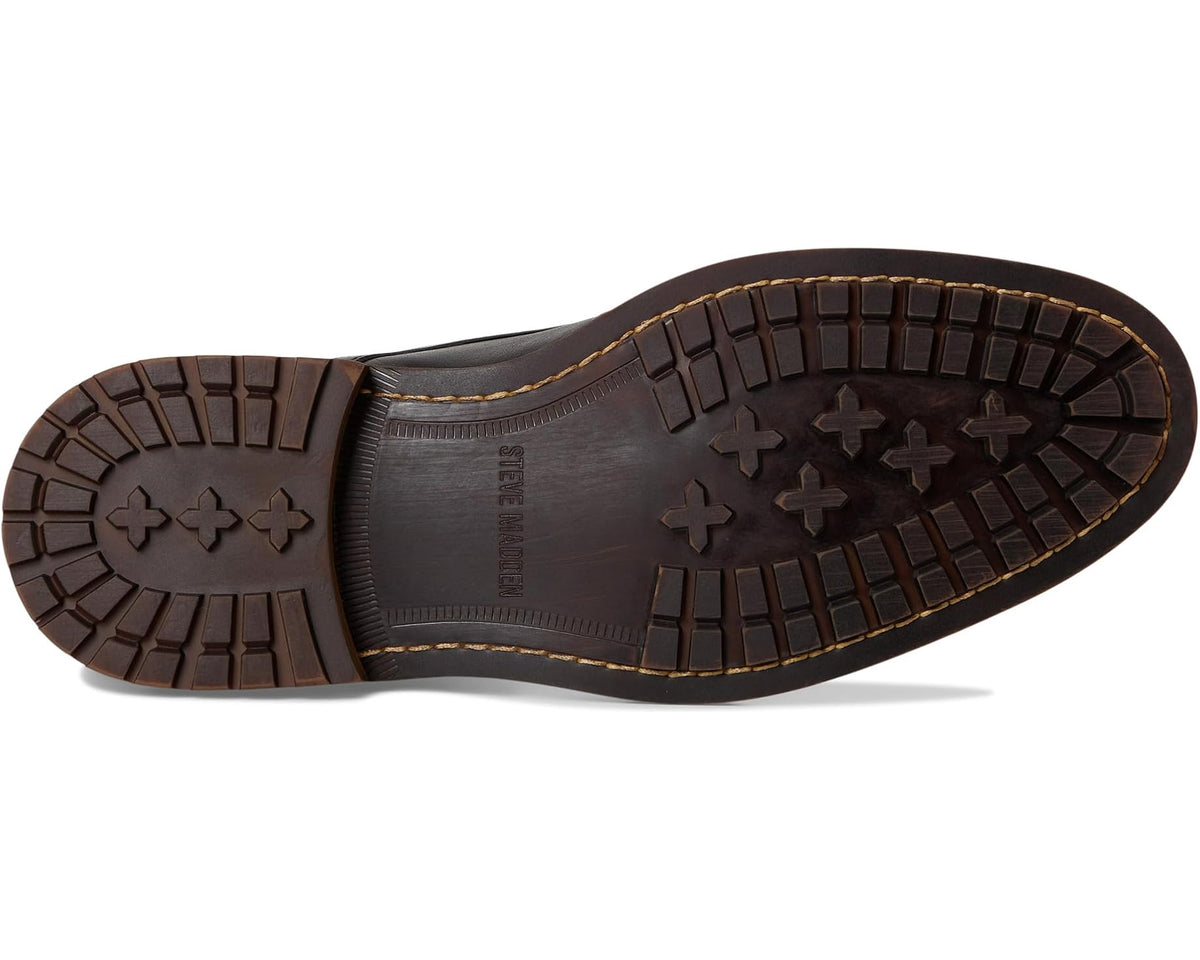Black boot outsole with textured traction tread and raised star and plus patterns