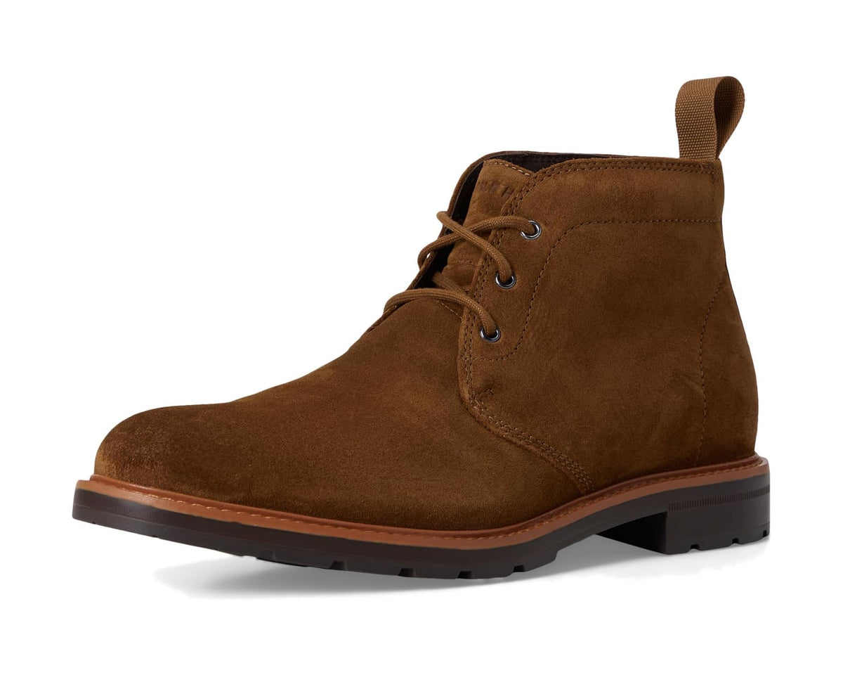 Brown lace-up chukka boots with ankle pull tab and textured rubber outsole