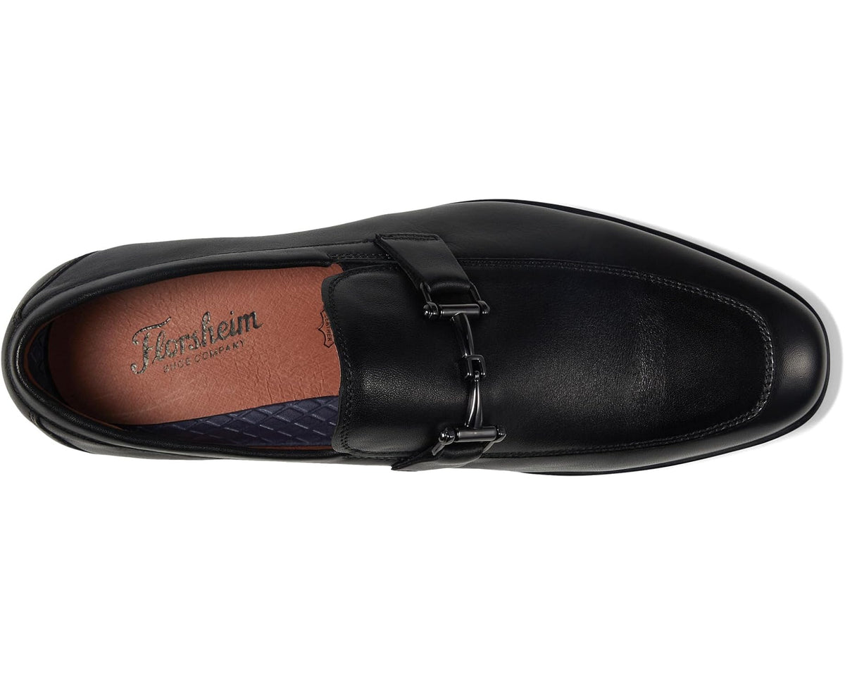 Black moc-toe loafers with side bit strap; tan interior lining visible