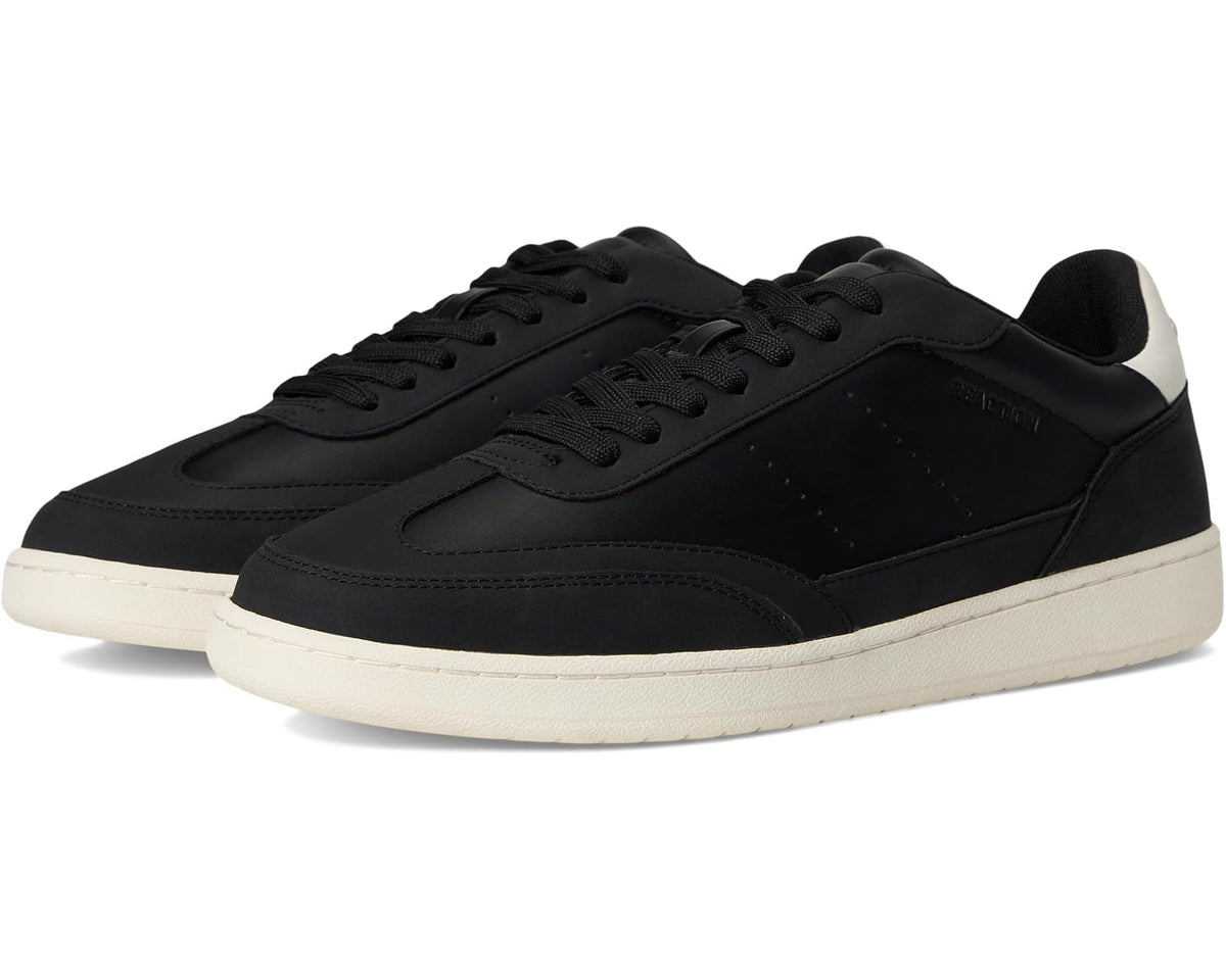 Black and white low-top sneakers with lace-up closure and white rubber sole