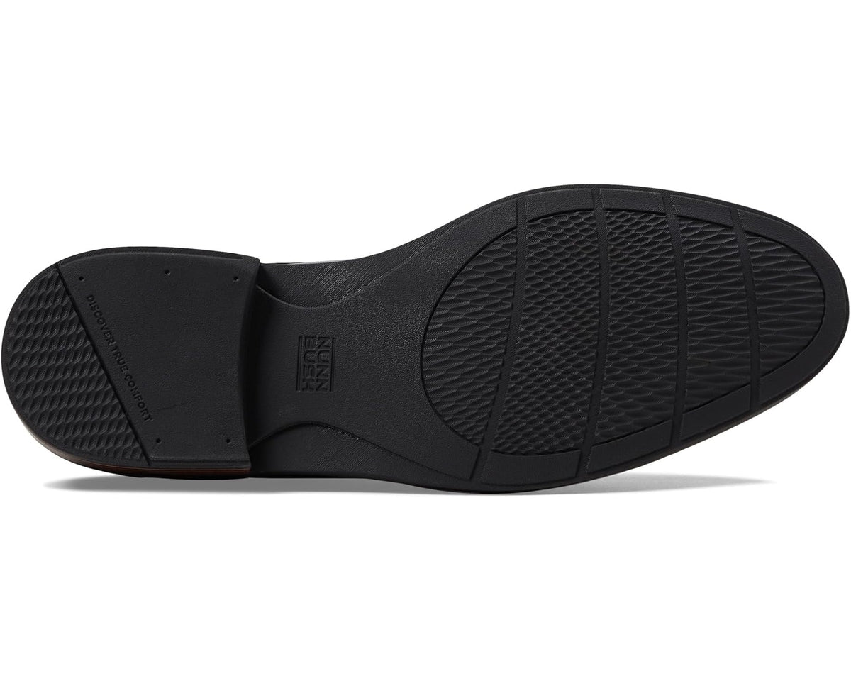 Black Oxford shoe outsole with textured rubber tread