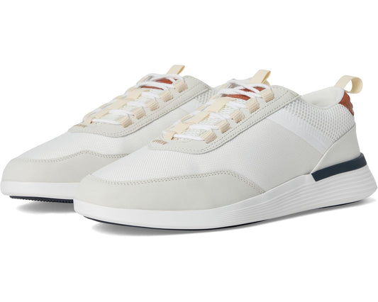 White low-top lace-up crossover sneakers with tonal panels and navy heel stripe