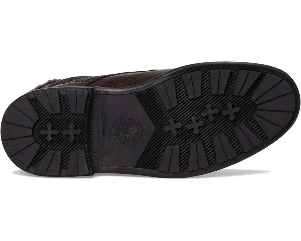 Dark brown shearling-lined boot outsole with tread and traction icons