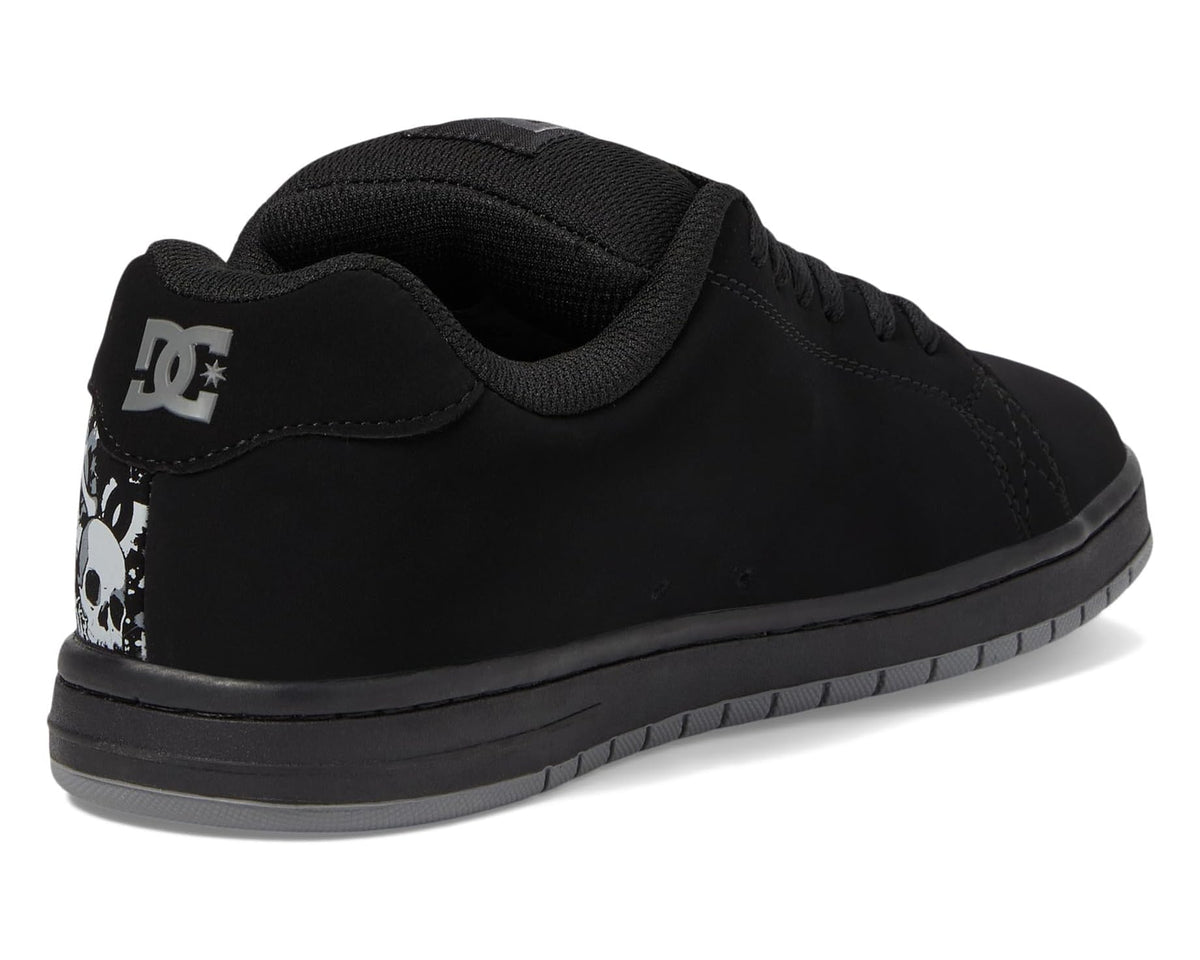 Black skate sneakers with DC logo on heel and skull print on the back.