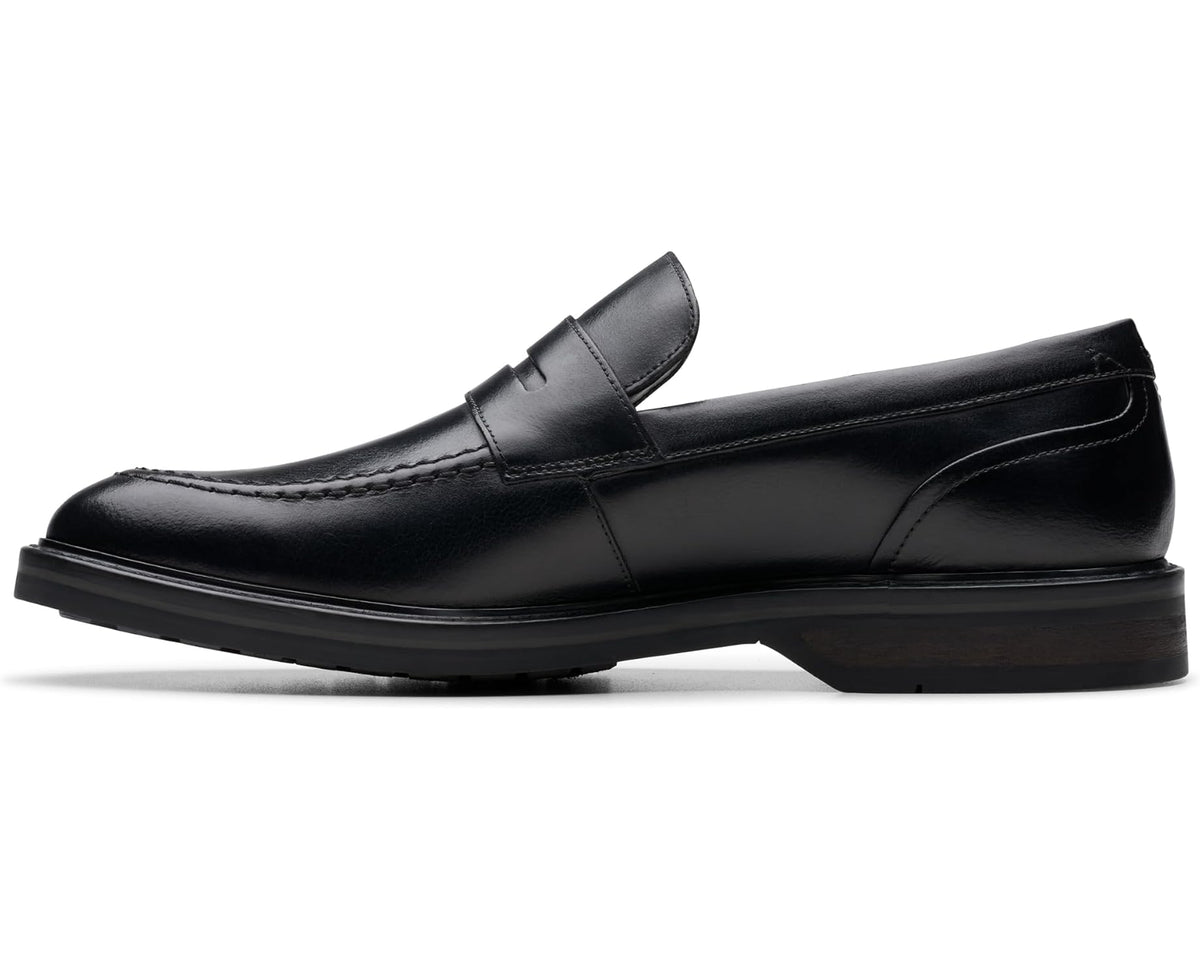 Black leather penny-style loafer with strap detail and low heel