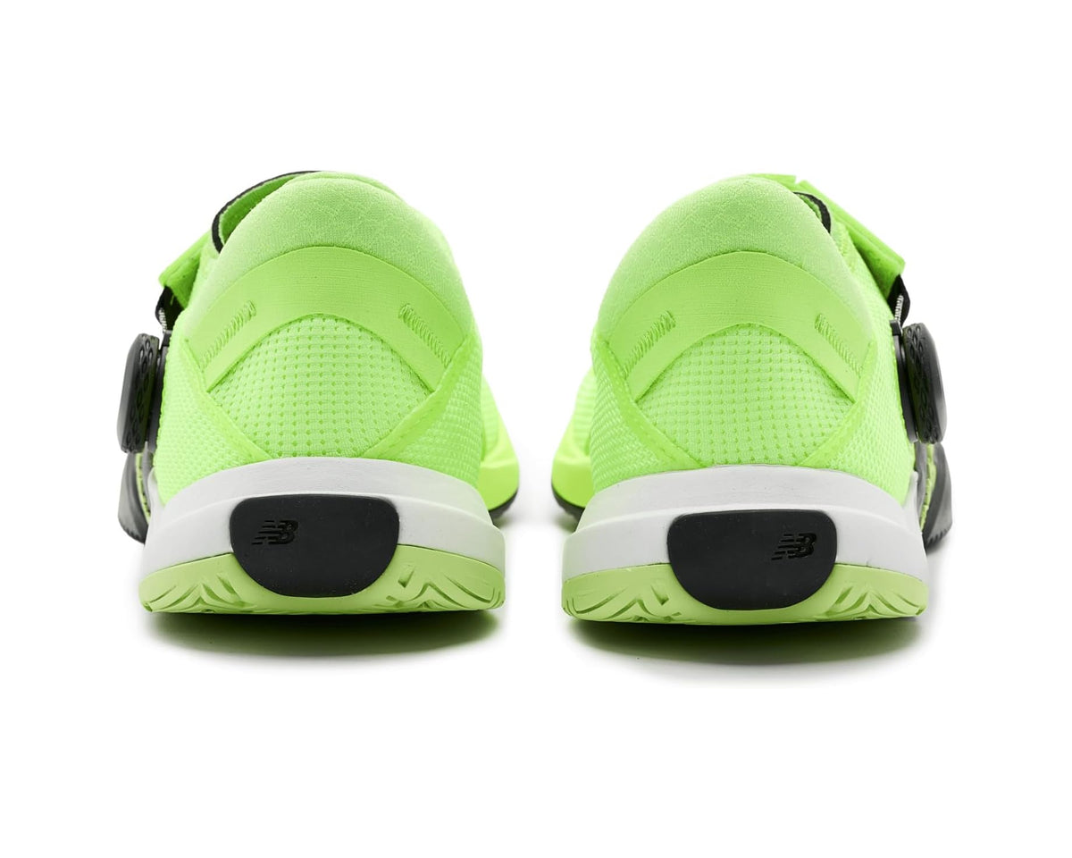 Pair of men's neon green training shoes with black heel pull and gray soles