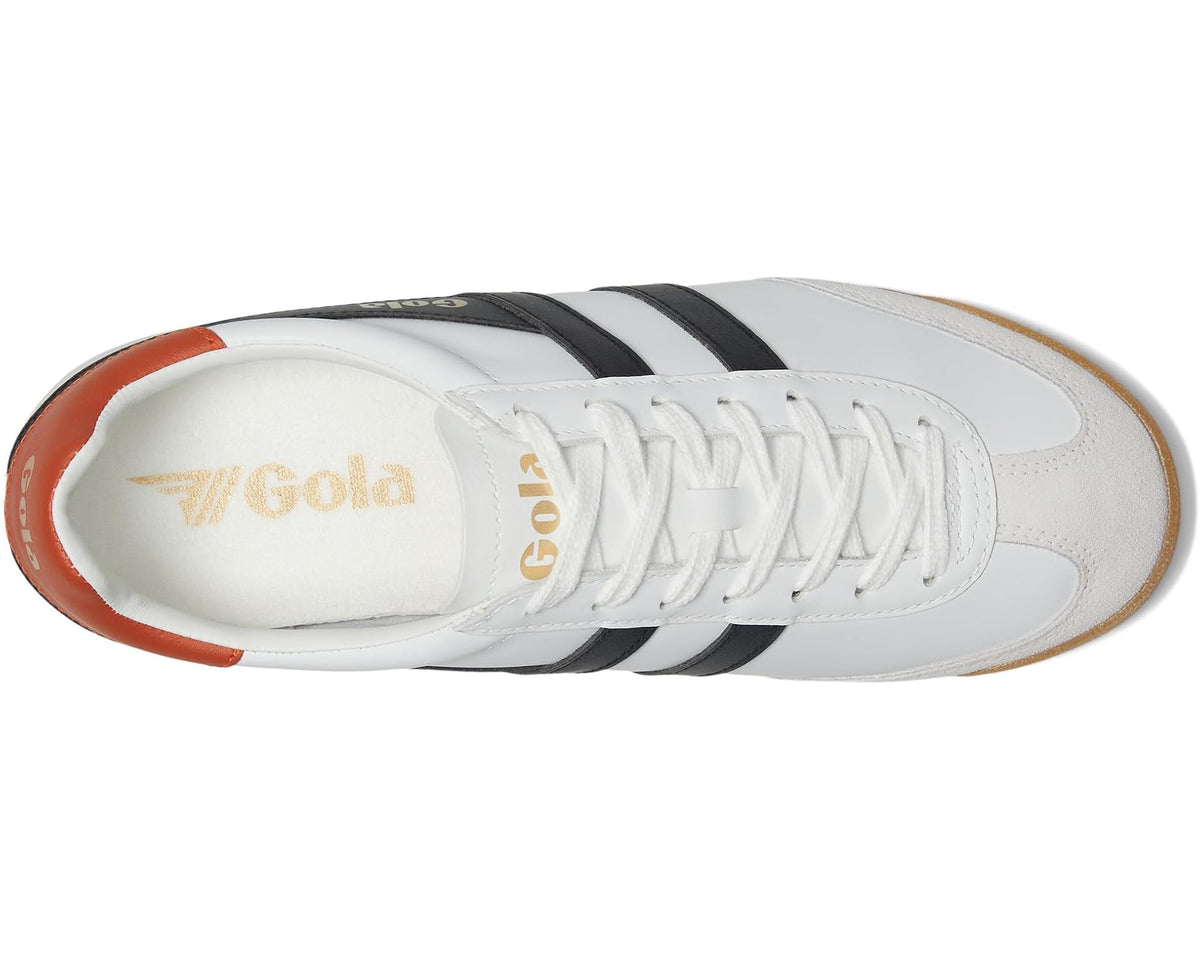 White leather sneakers with black triple stripes, orange heel trim, and side logo
