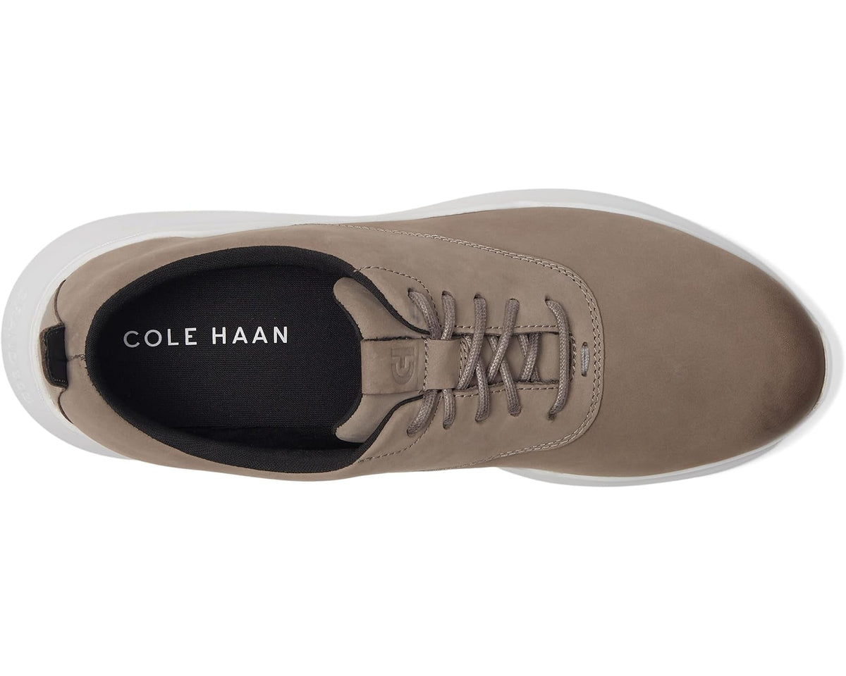 Grey nubuck sneakers, side opening view with lace-up closure and black lining