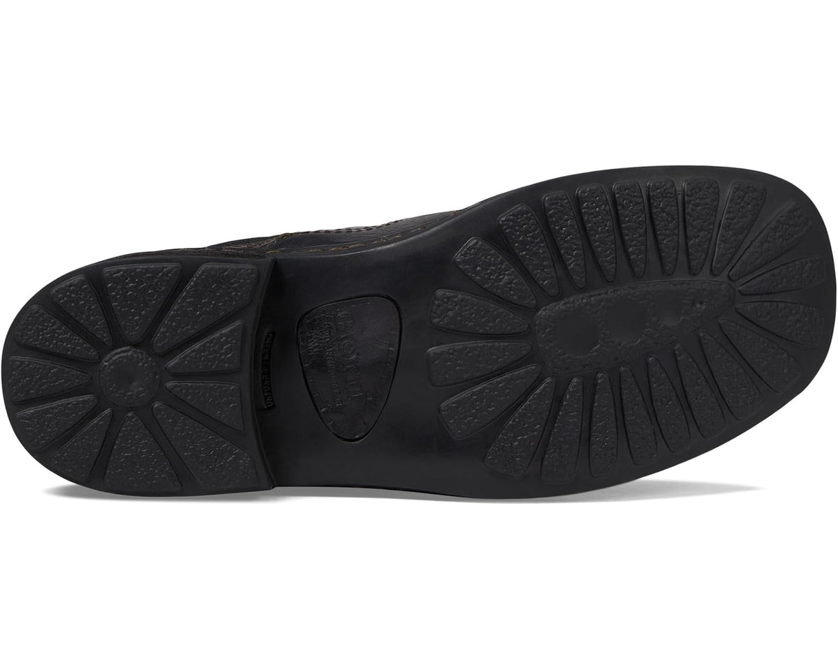 Black rubber outsole for ankle Chelsea boot with textured tread pattern