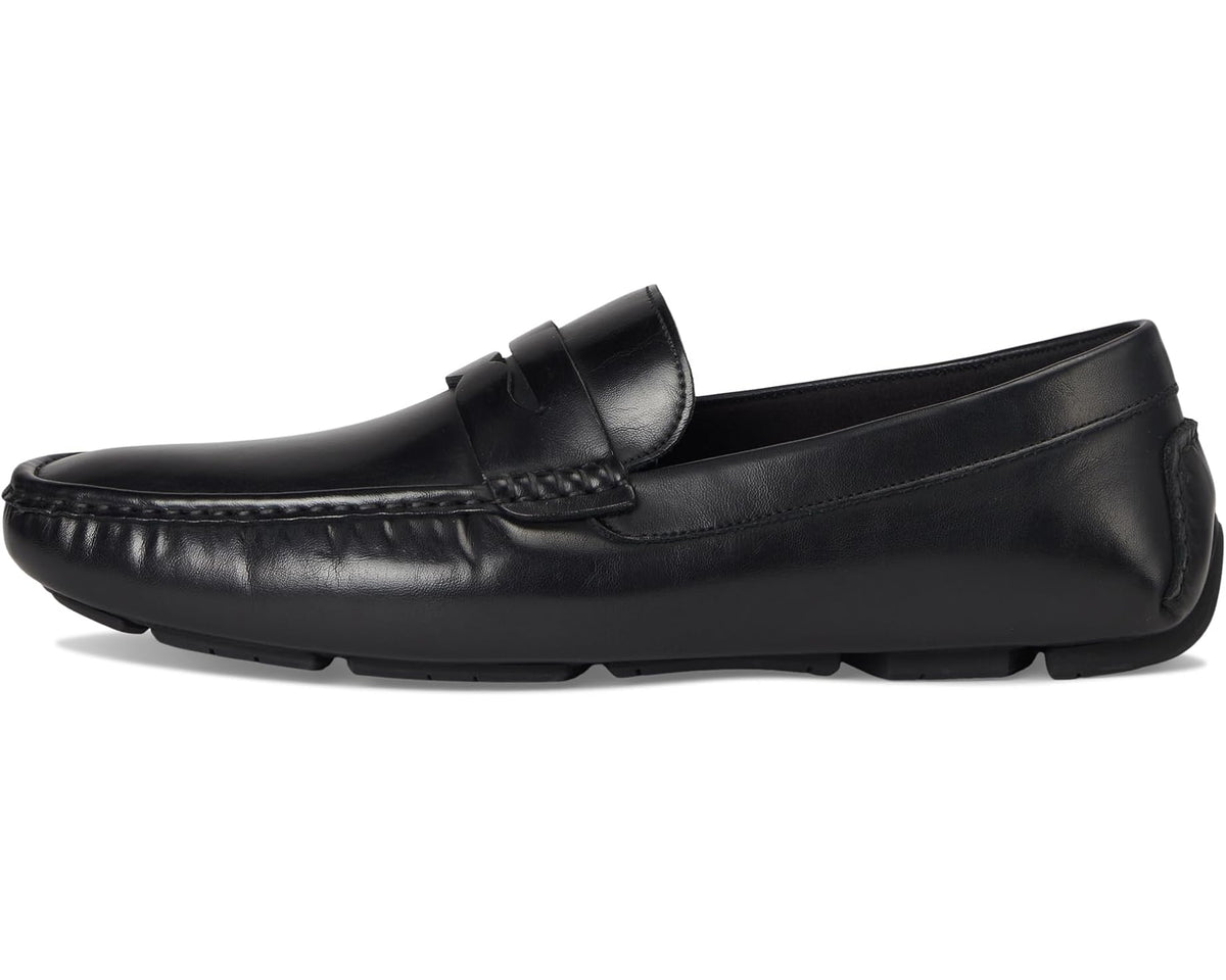 Black leather slip-on loafer with apron stitching and low-profile sole
