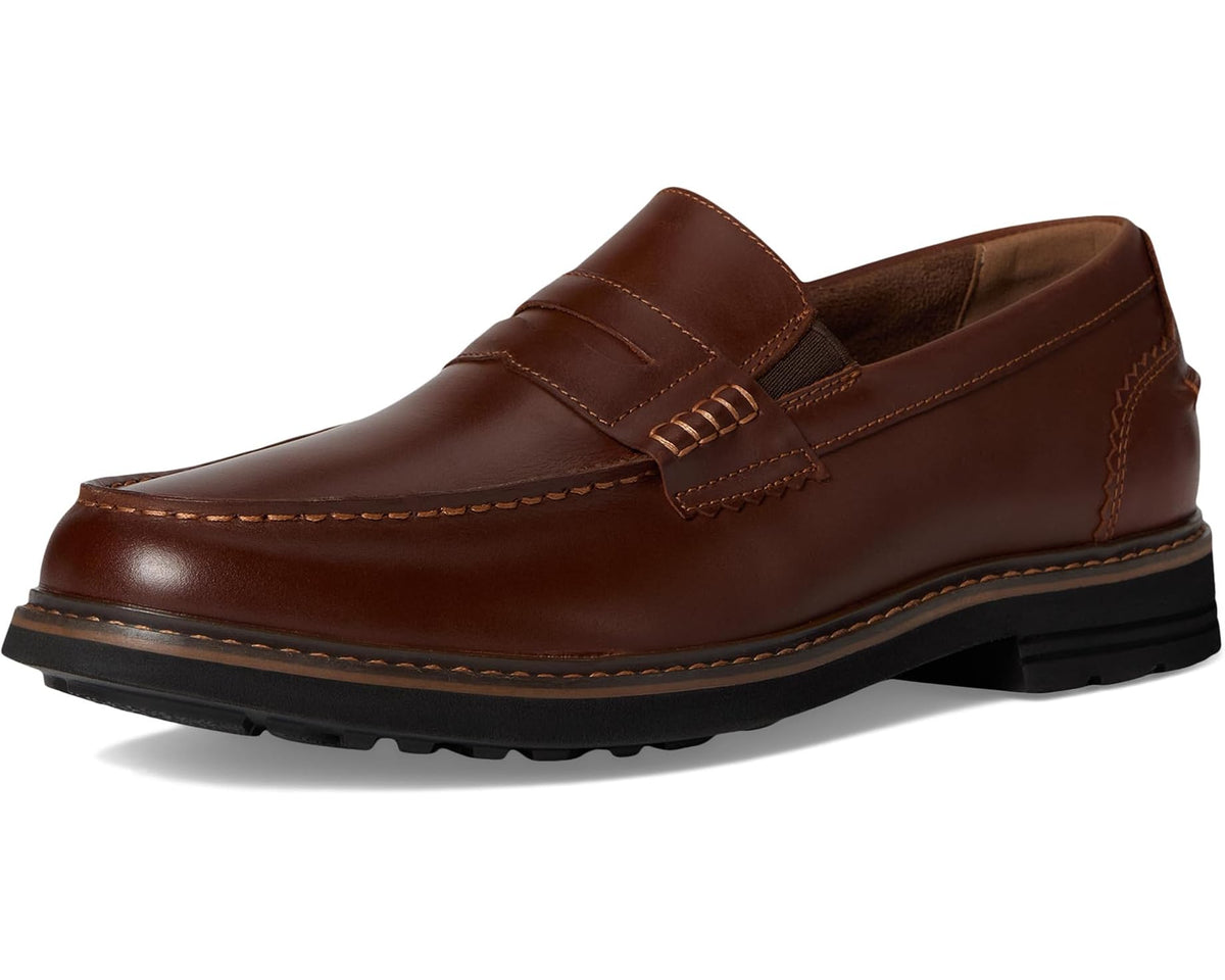 Cognac moc-toe penny loafer slip-on style with penny keeper and stitched seams
