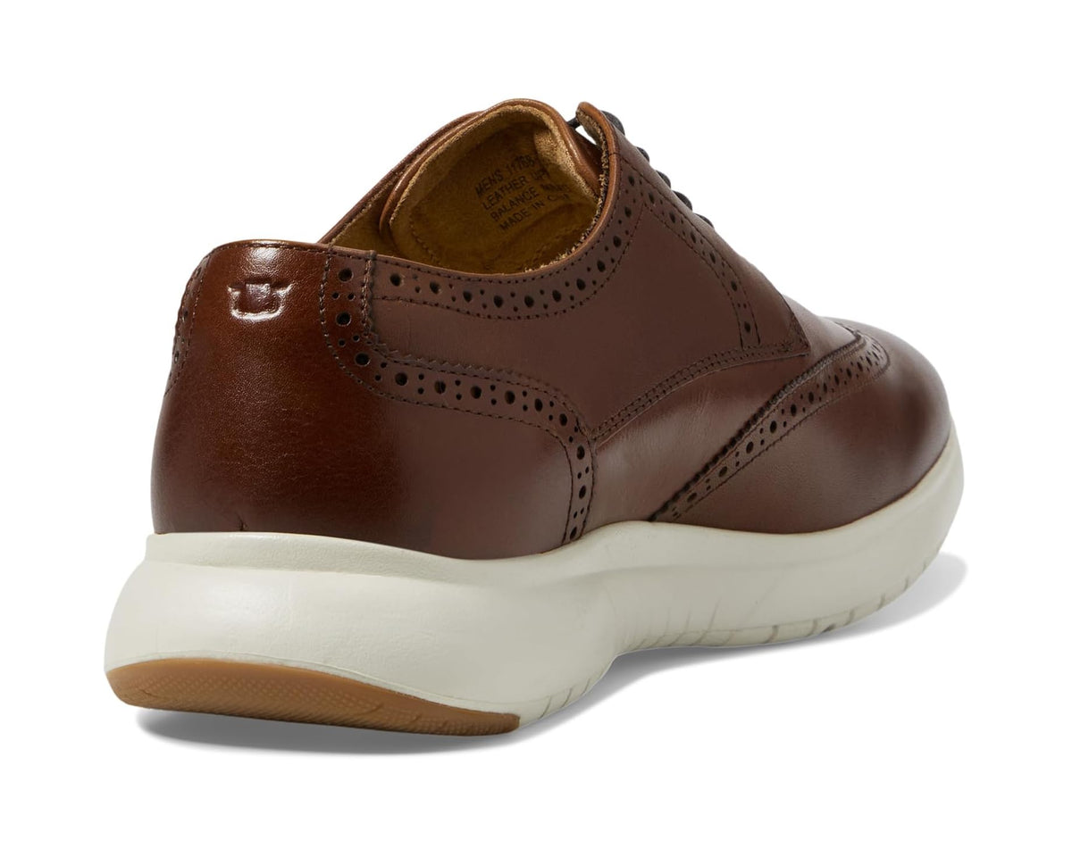 Florsheim men's oxford sneaker heel view, cognac leather with padded collar and white sole