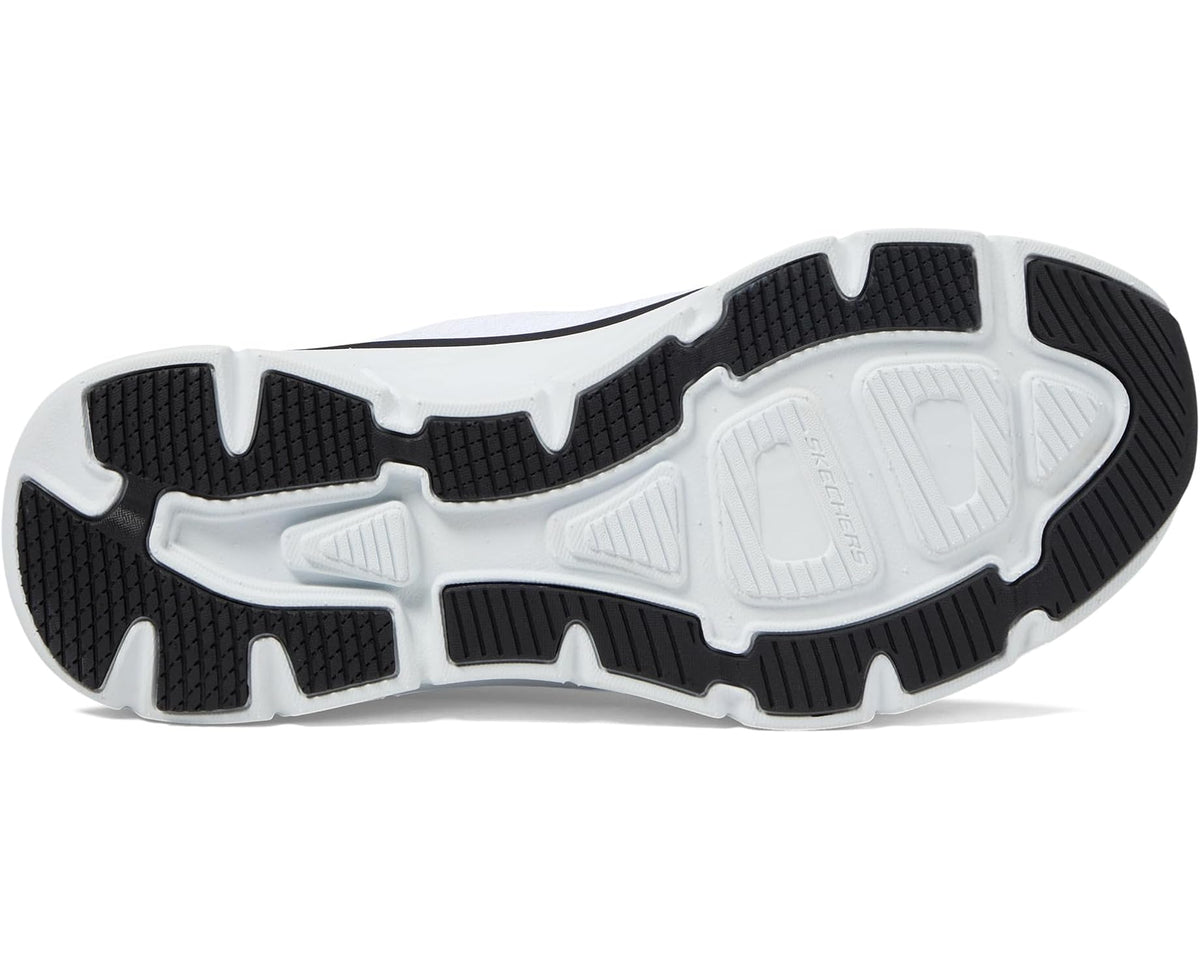 Outsole view of white and black slip-in sneaker with grippy traction tread