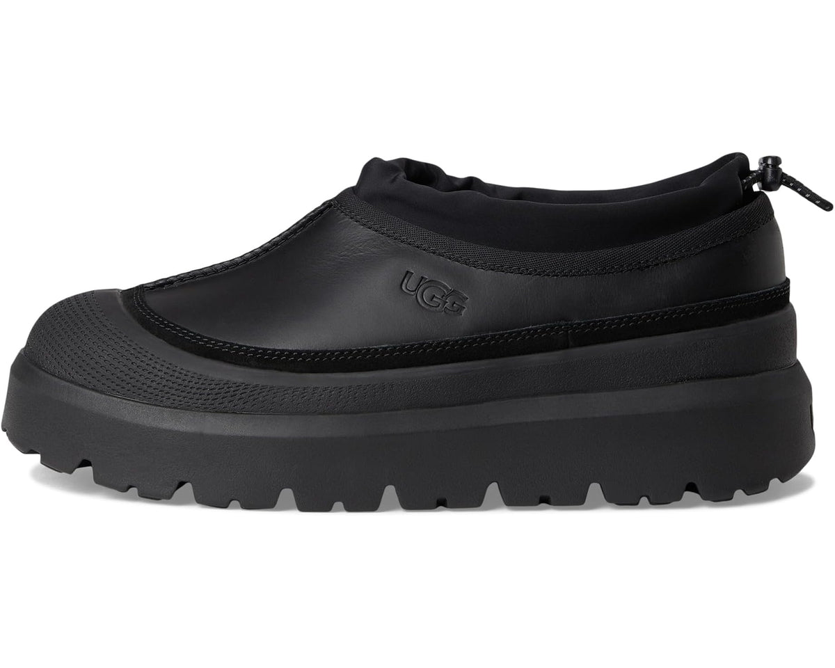 Black UGG slip-on boot with stitched detail, pull-tie cord, and chunky platform sole