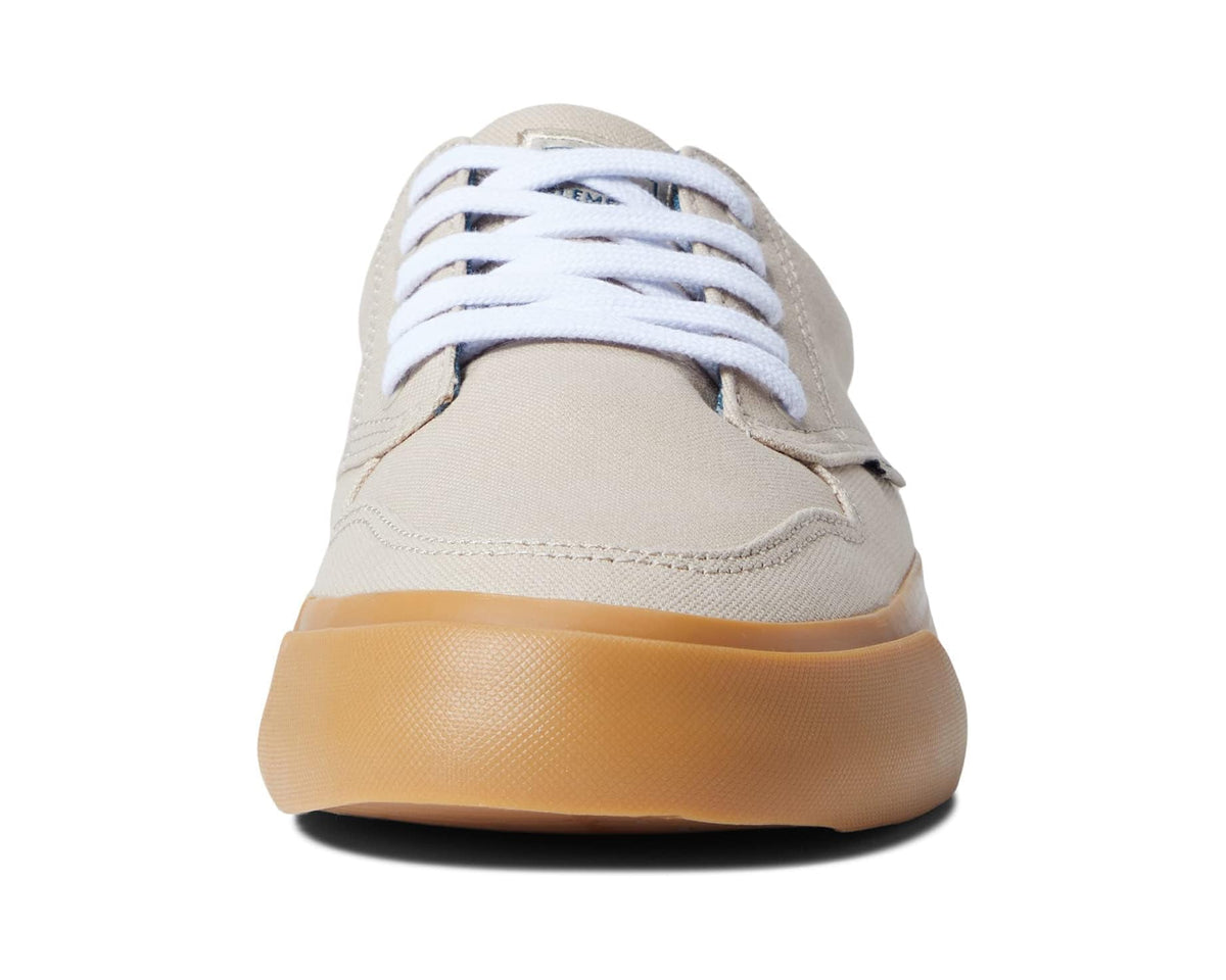 Tan low-top sneakers with white laces and gum rubber sole, back view