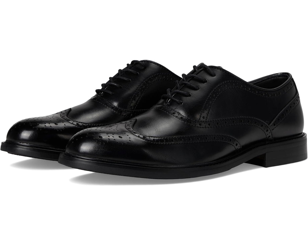 Black lace-up oxford dress shoe with wingtip brogue detailing and perforated toe.