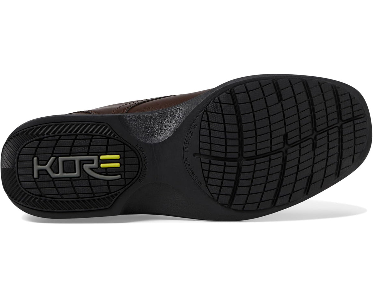 Brown moc toe oxford shoe outsole with KORE traction logo