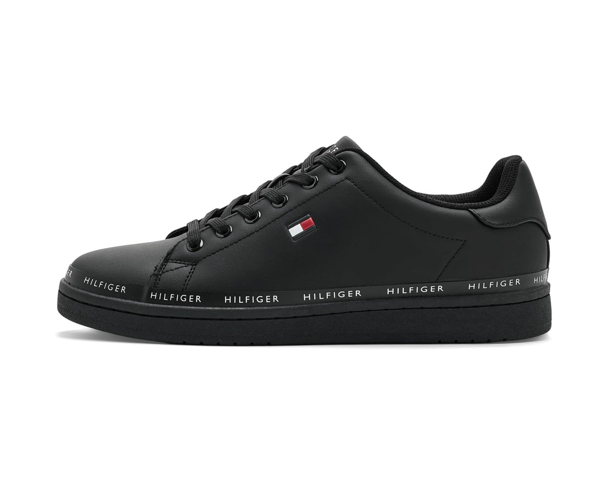 Men's black low-top sneakers, side/front view with lace-up design and flag logo