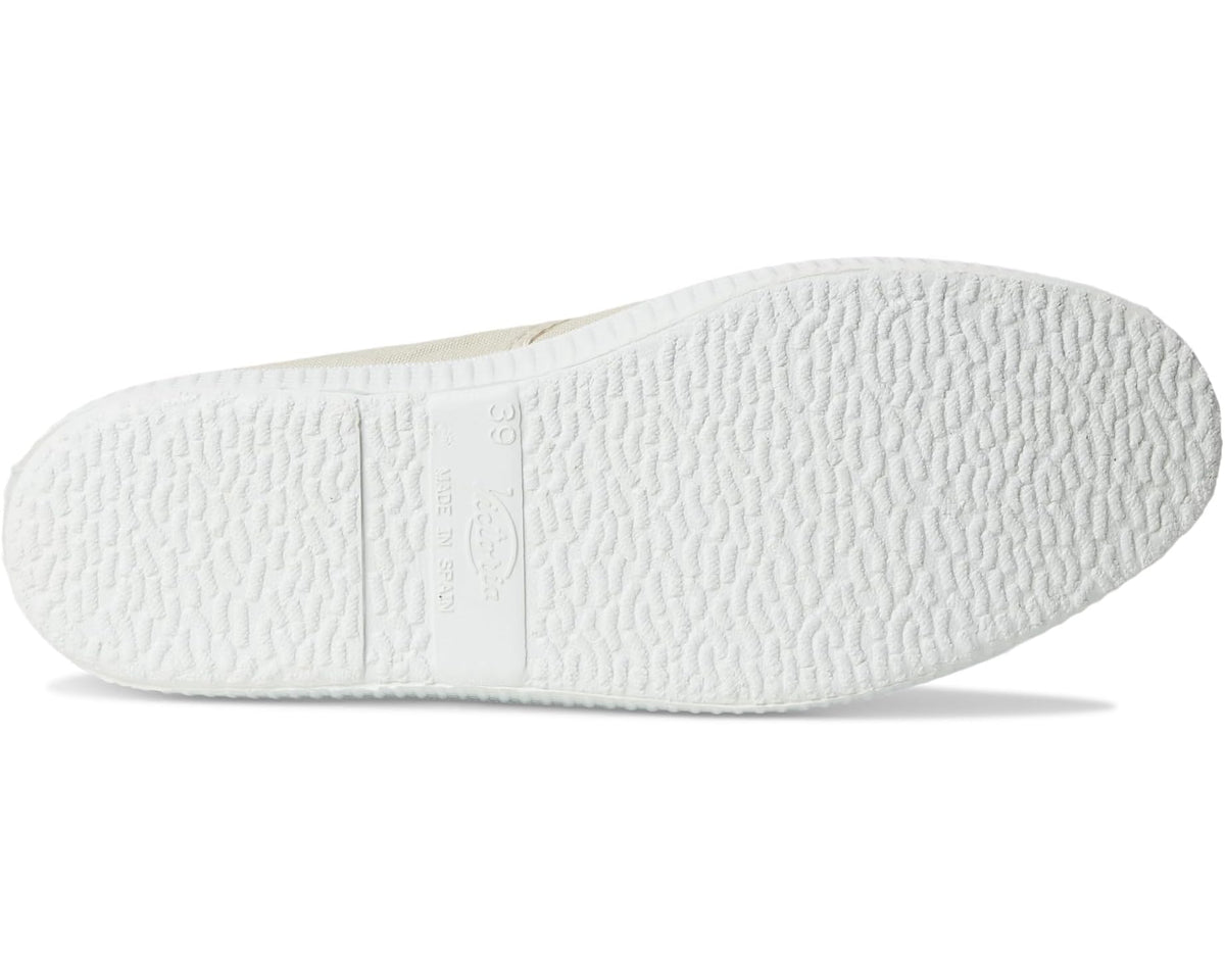 Women's beige canvas sneakers, textured white outsole view