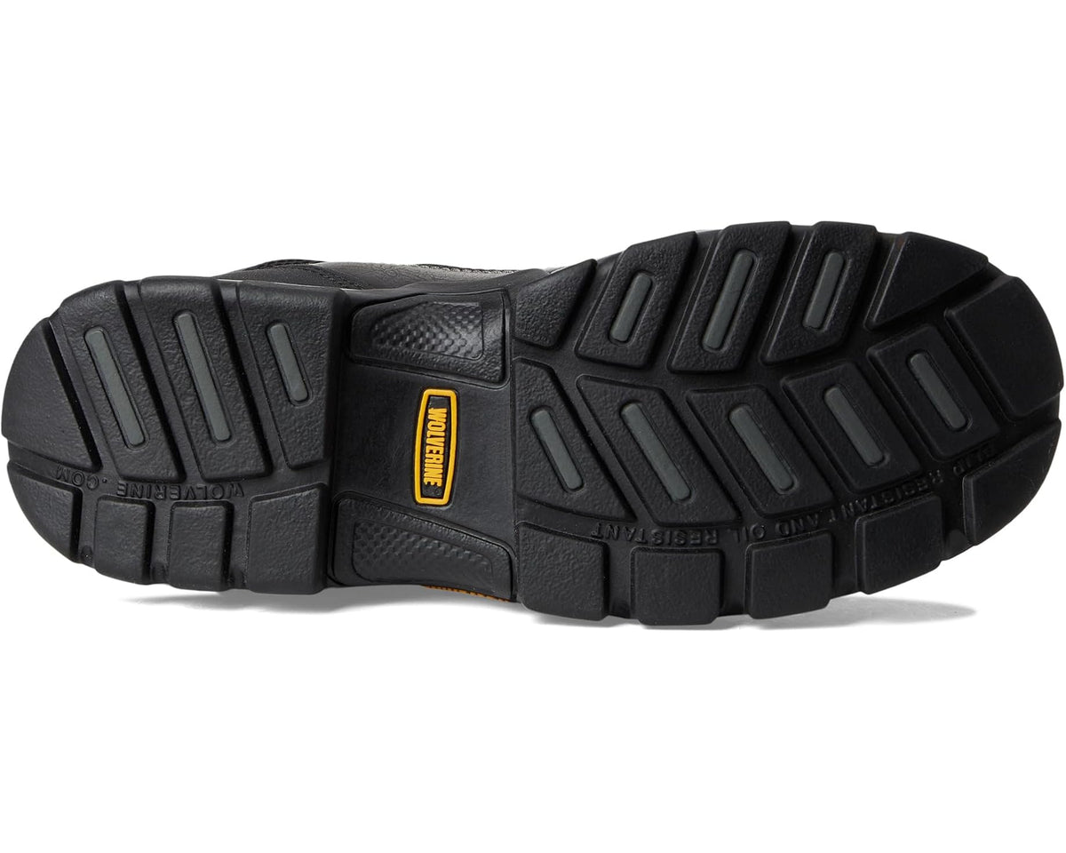 Black outsole of work boot with deep tread and molded heel for traction