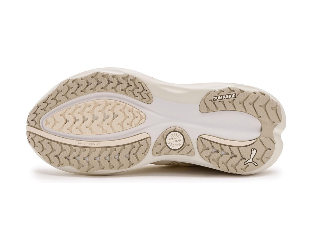 Off-white running shoe outsole with textured traction tread and heel pods