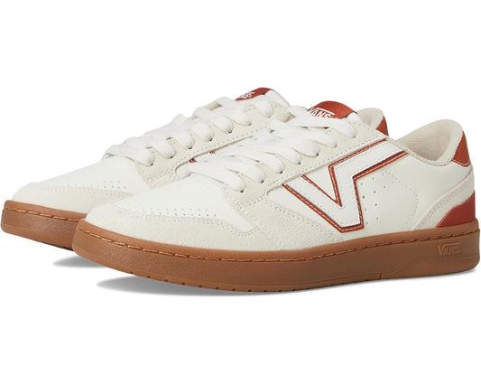 Low-top canvas sneakers with white uppers, red V side stripe, and gum rubber sole