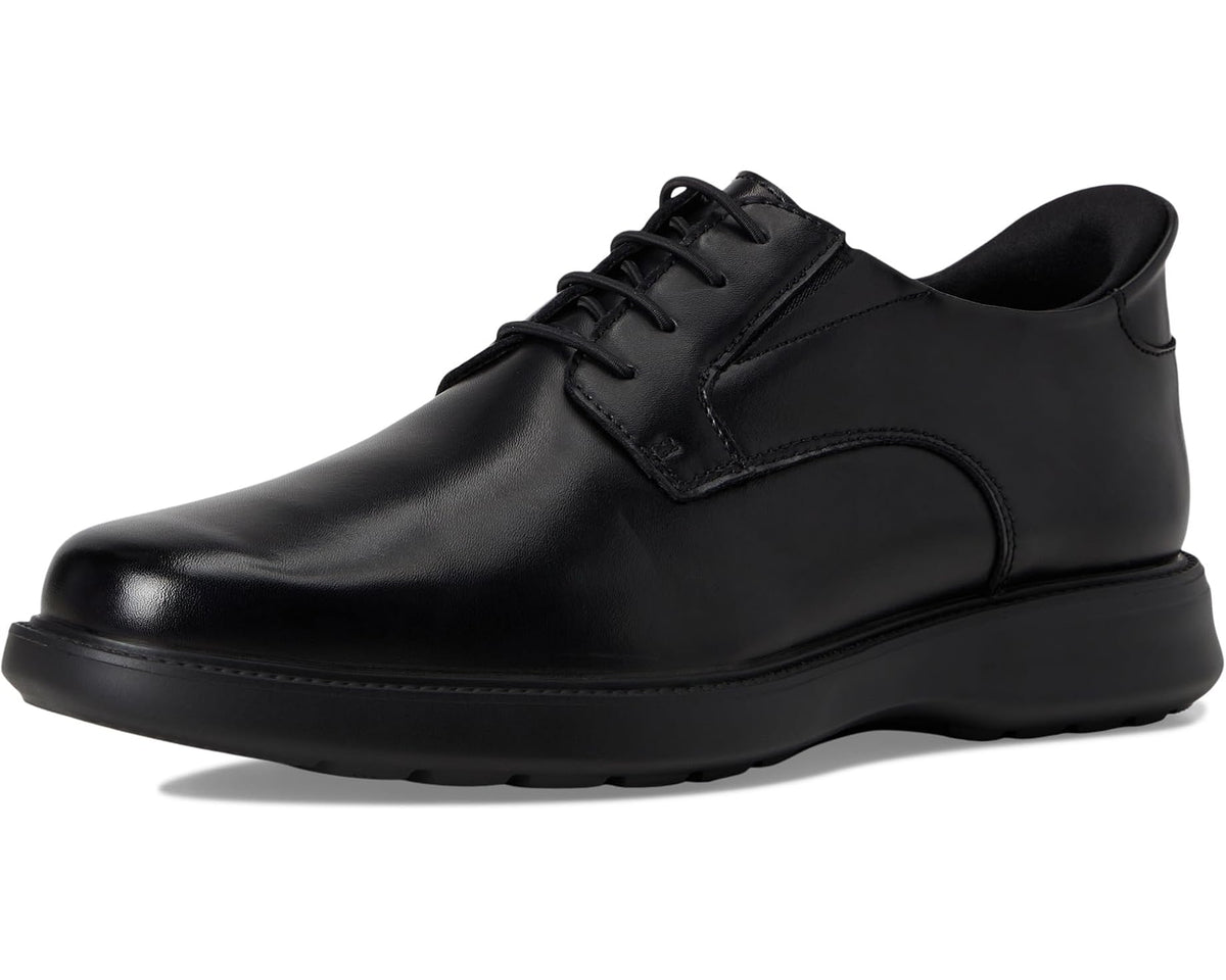 Black men's lace-up leather oxford shoe, angled side view with thick rocker sole
