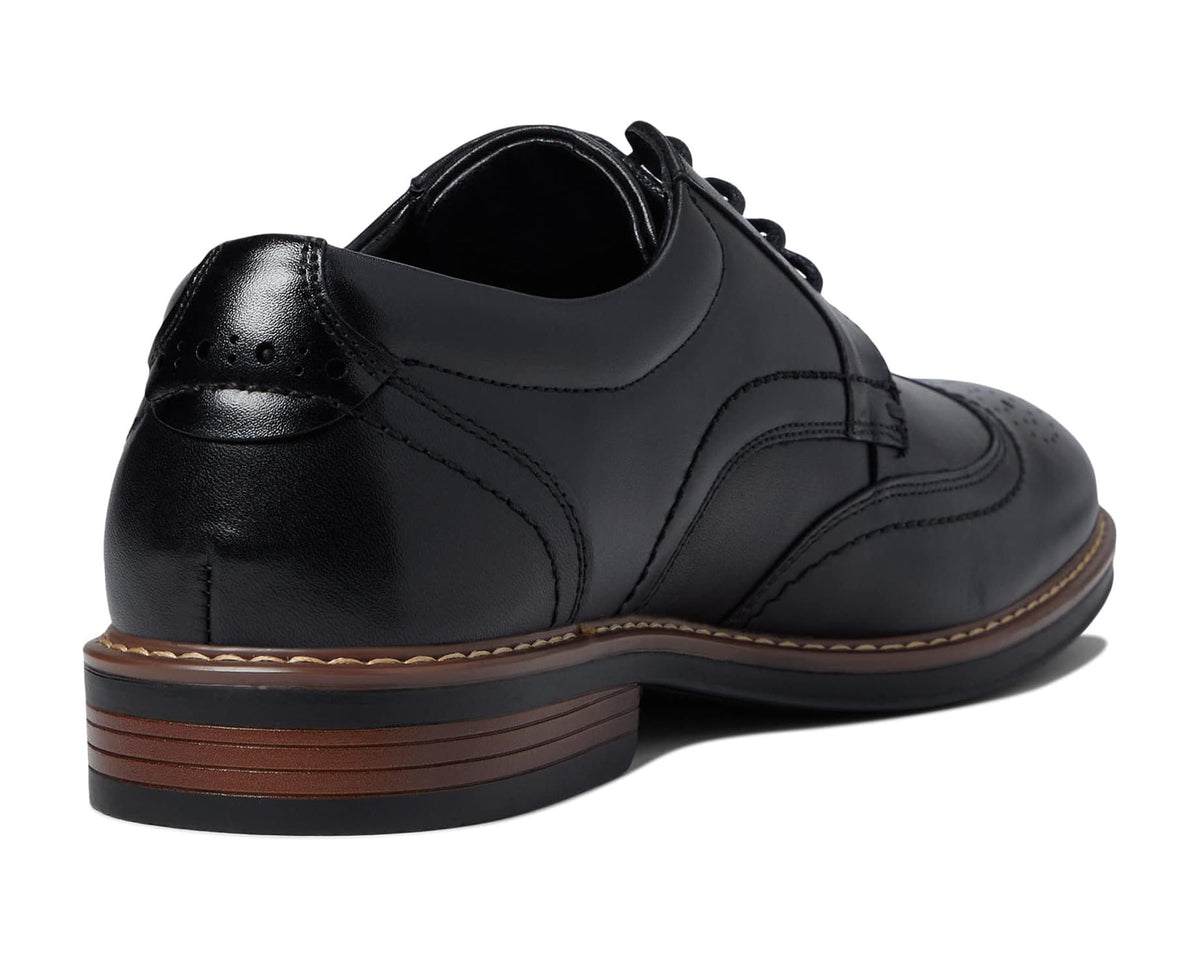 Black leather lace-up Oxford shoes with low heel and brown outsole stripe
