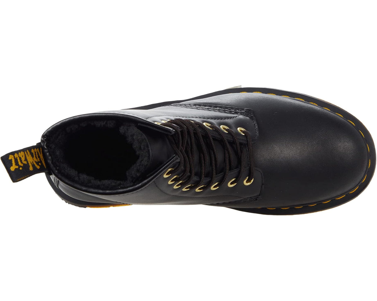 Black waterproof lace-up ankle boot showing plush black lining and yellow laces