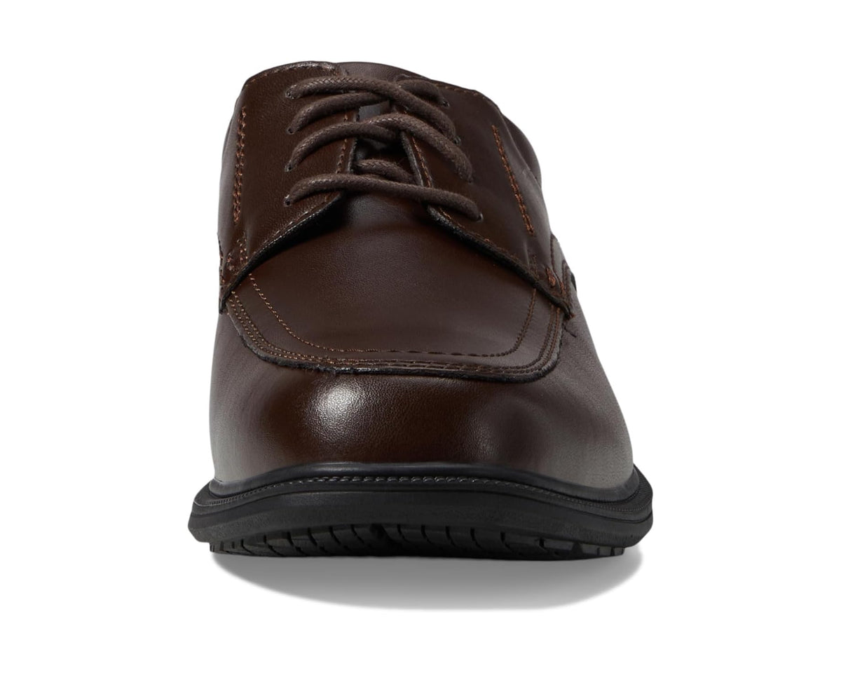 Brown lace-up moc toe oxford shoe side view with textured rubber outsole