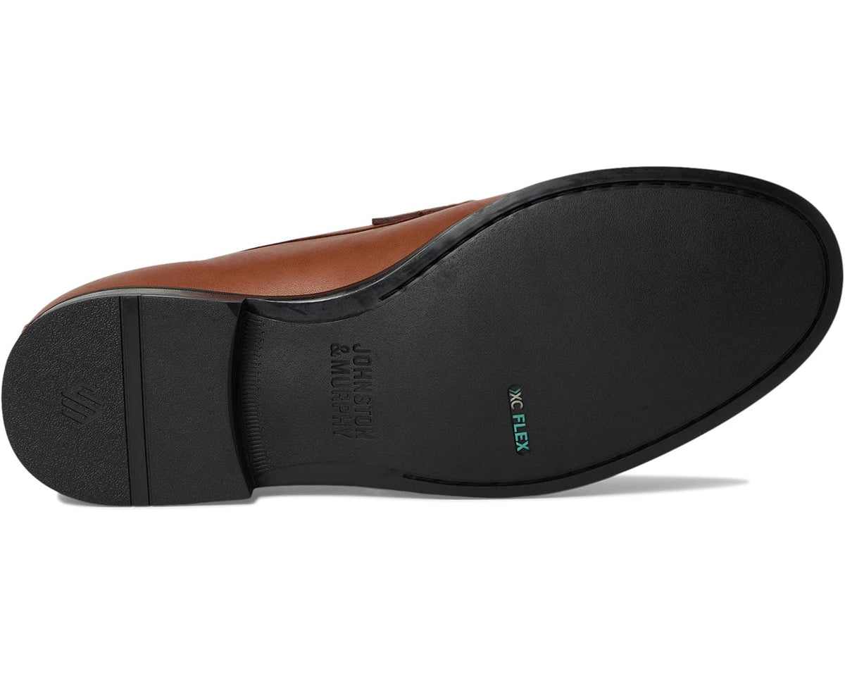Cognac leather penny loafer outsole with black rubber sole and heel