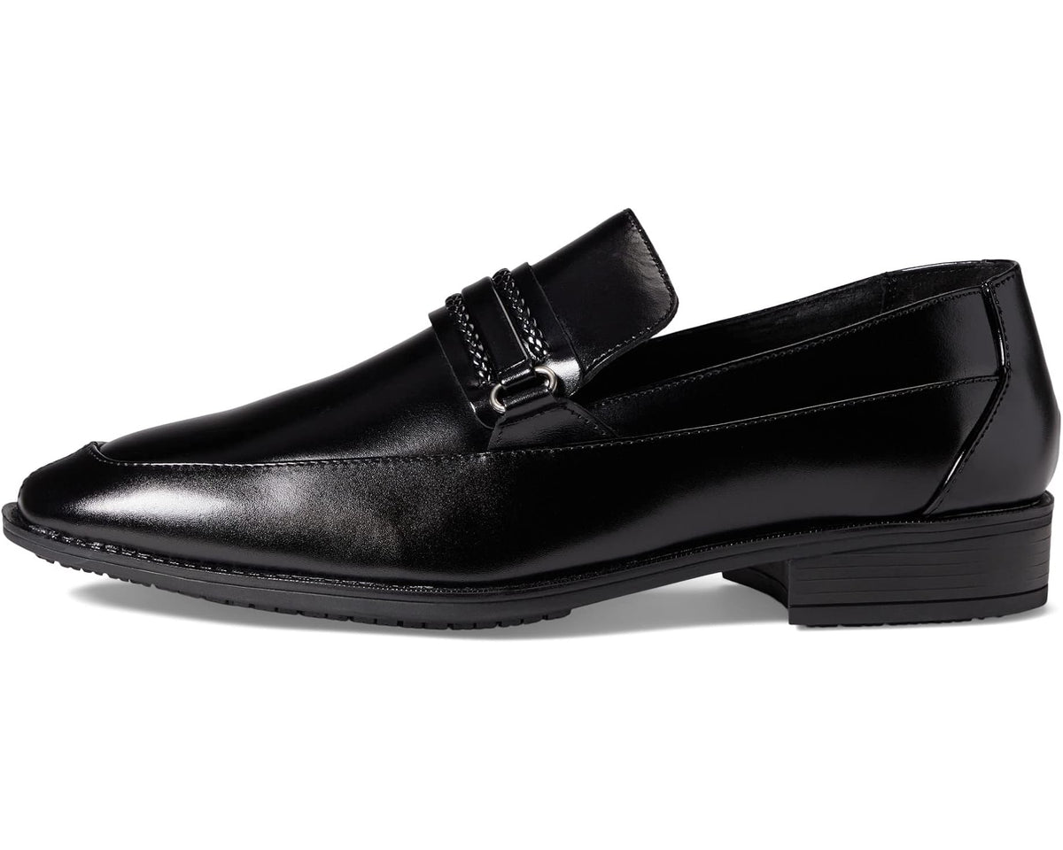 Black leather-look slip-on loafer with adjustable strap and low block heel.