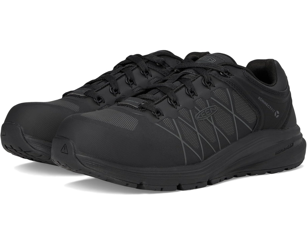 Black work sneaker with carbon toe, lace-up front, and rugged treaded outsole