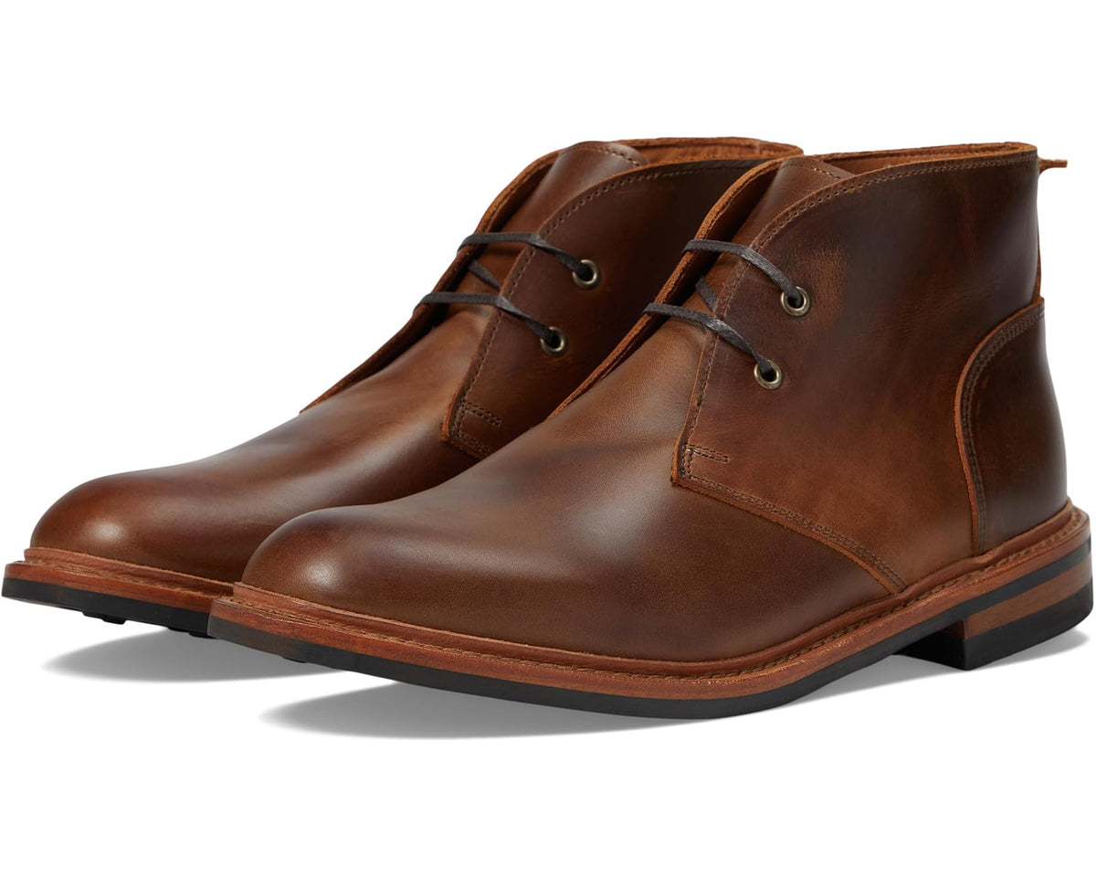 Brown leather lace-up ankle boot with eyelets and stitched welt sole