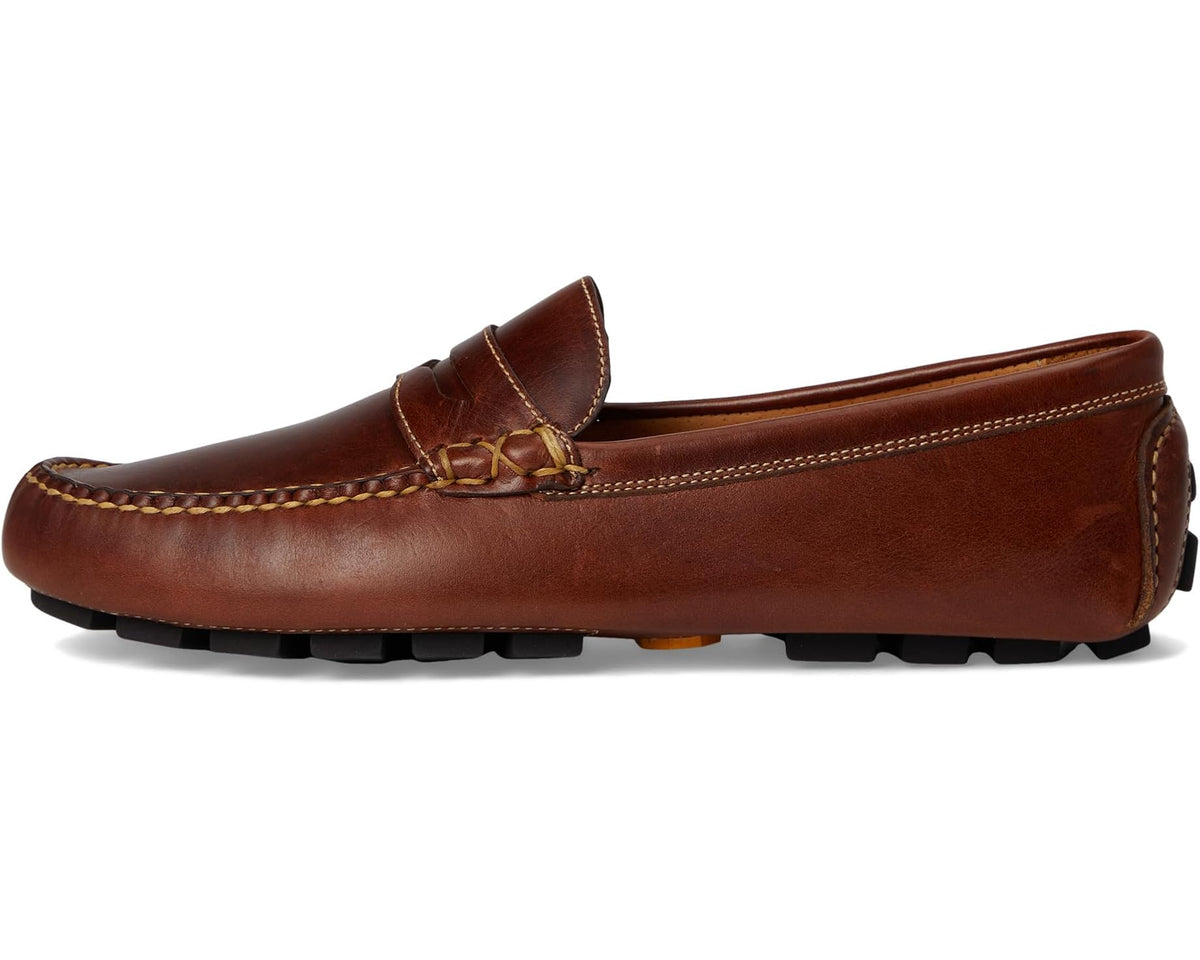 Cigar brown leather driver-style penny loafer with stitched upper and bow-like strap