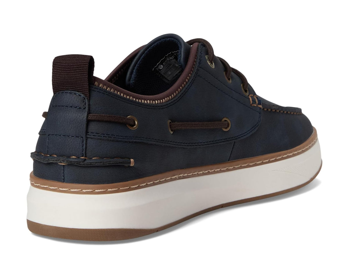 Men's navy moccasin boat shoe heel with padded collar and brown sole edge